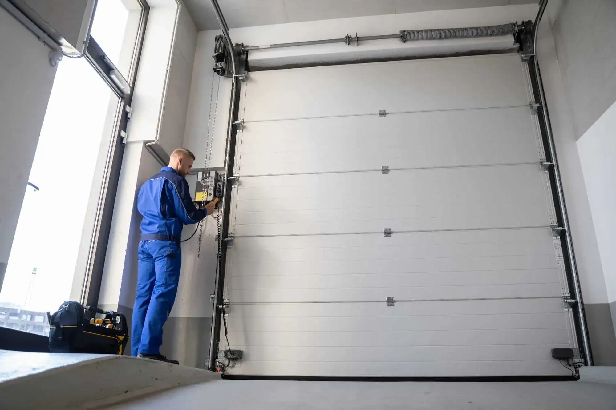 Garage Door Technician Working Nassau County New York