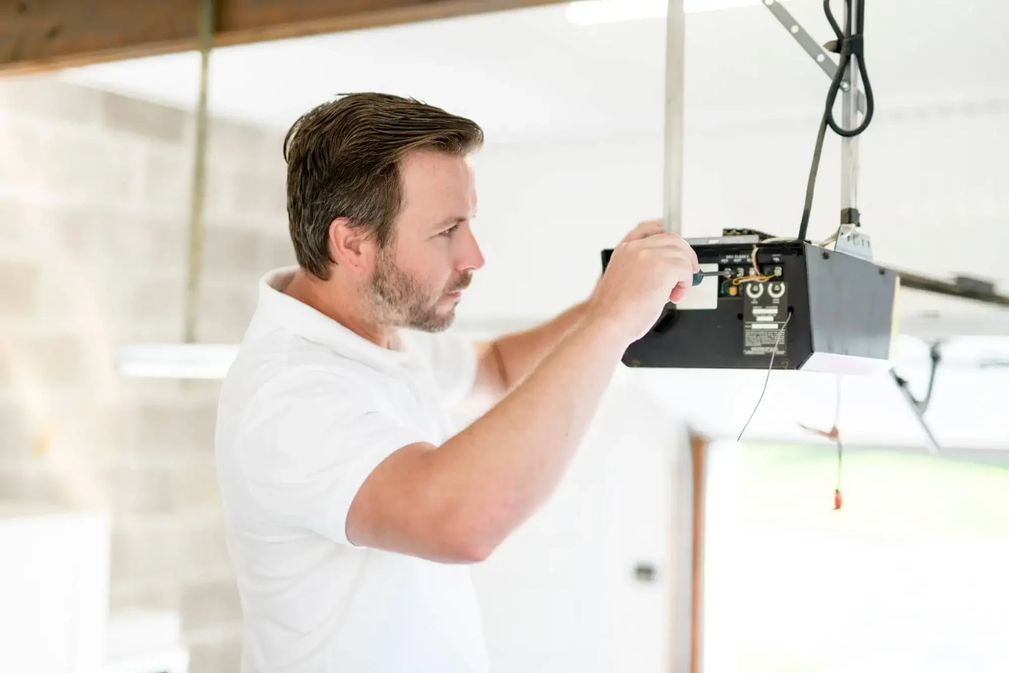 Technician Fixing Garage Door Nassau County New York