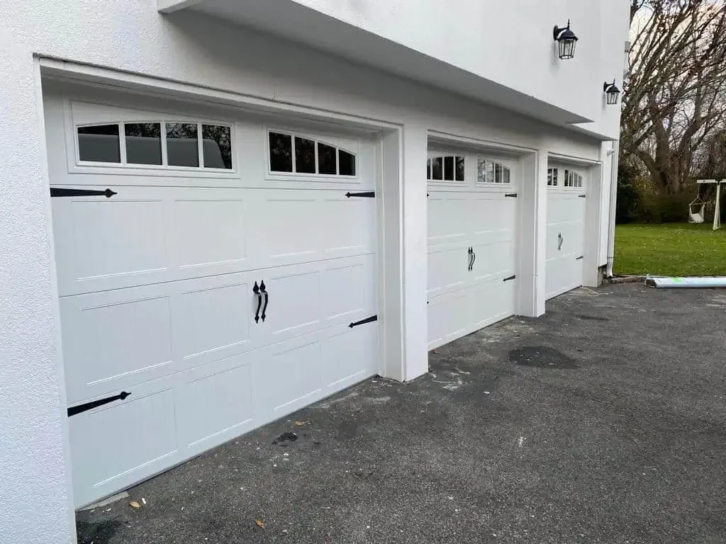 Three White Garage Doors Nassau County New York